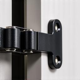 Close-up of a soft-close cabinet hinge.